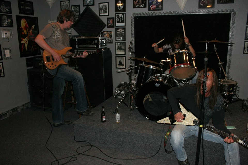 taka and kevin and his friend are jaming, taka on drums